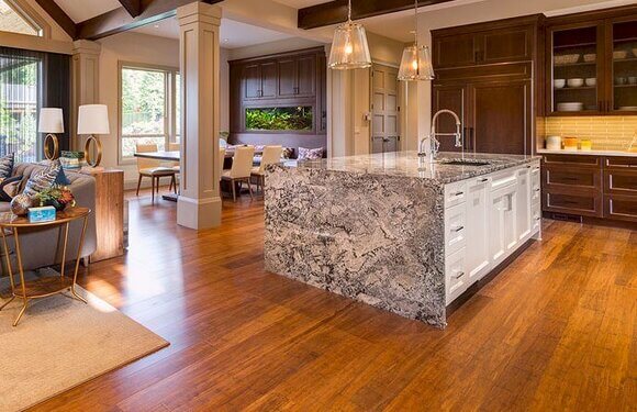 Carbonized strand woven bamboo flooring in a beautiful living room and kitchen