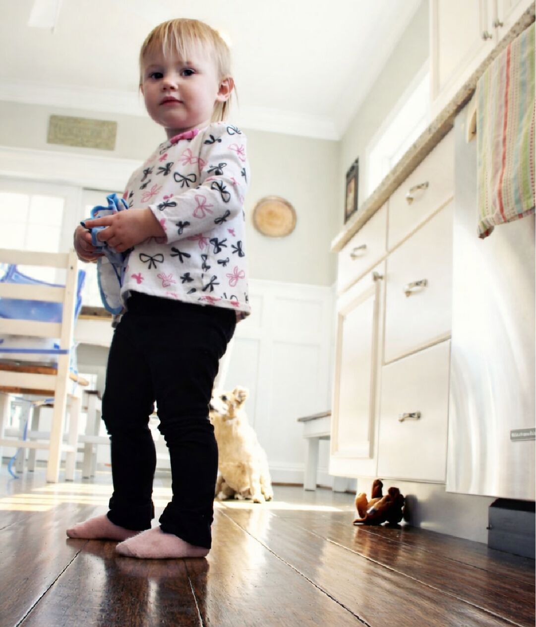 Child standing safely on Ambient bamboo flooring